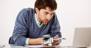 Magnifying glass searching for unclaimed money, lost funds, or hidden cash