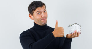 First-time homebuyers reviewing their finances and budget for buying a house