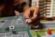 An illustration showing a growing stack of money next to a modern apartment complex, symbolizing the financial benefits of an apartment complex for sale investment.