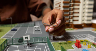 An illustration showing a growing stack of money next to a modern apartment complex, symbolizing the financial benefits of an apartment complex for sale investment.
