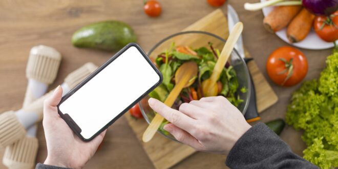Person eagerly searching for restaurants near me on their smartphone screen showing a map interface.