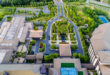 A sprawling modern apartment complexes for sale with multiple buildings and green spaces in a thriving US city.