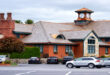 Exterior view of the inviting Old Mill Condominiums Provo UT, showcasing well-maintained buildings and landscaping.