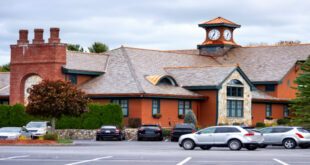 Exterior view of the inviting Old Mill Condominiums Provo UT, showcasing well-maintained buildings and landscaping.