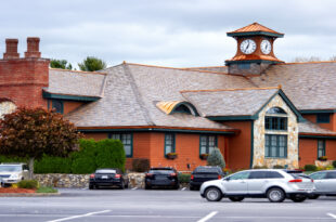 Exterior view of the inviting Old Mill Condominiums Provo UT, showcasing well-maintained buildings and landscaping.