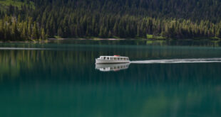 : Scenic view of an RV setup near the water, showcasing one of the beautiful table rock lake rv lots for sale.